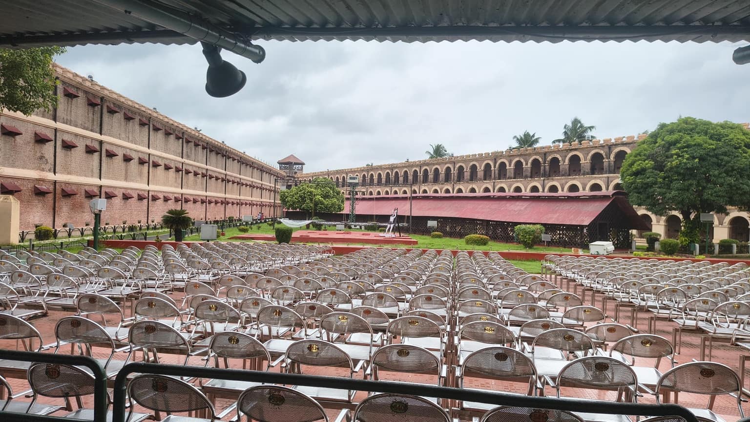 Open-air seating for the light-and-sound show in the Cellular Jail courtyard, with the cell wings and watchtower behind