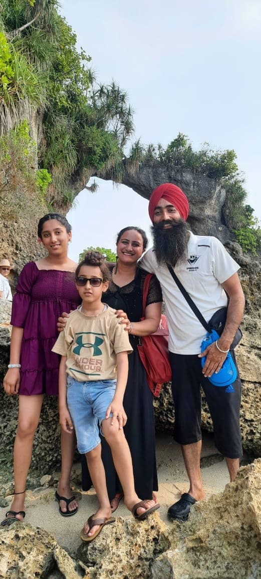Guests at the Natural Bridge rock formation, Neil Island