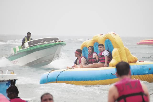 Travellers on a banana-boat ride at North Bay